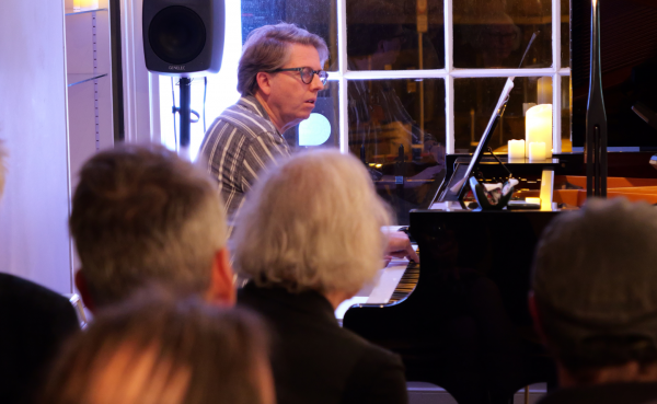 Composer Ian Wilson performing the piano part to one of his works at CMC.
